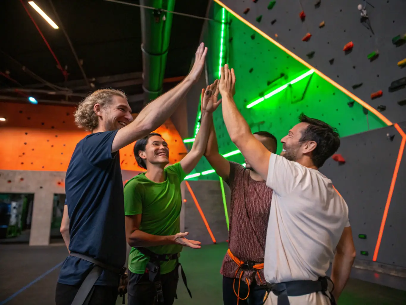 A group of climbers celebrating their achievements together, highlighting the social and community aspects of AURILLAC MONTAGNE ESCALADE.